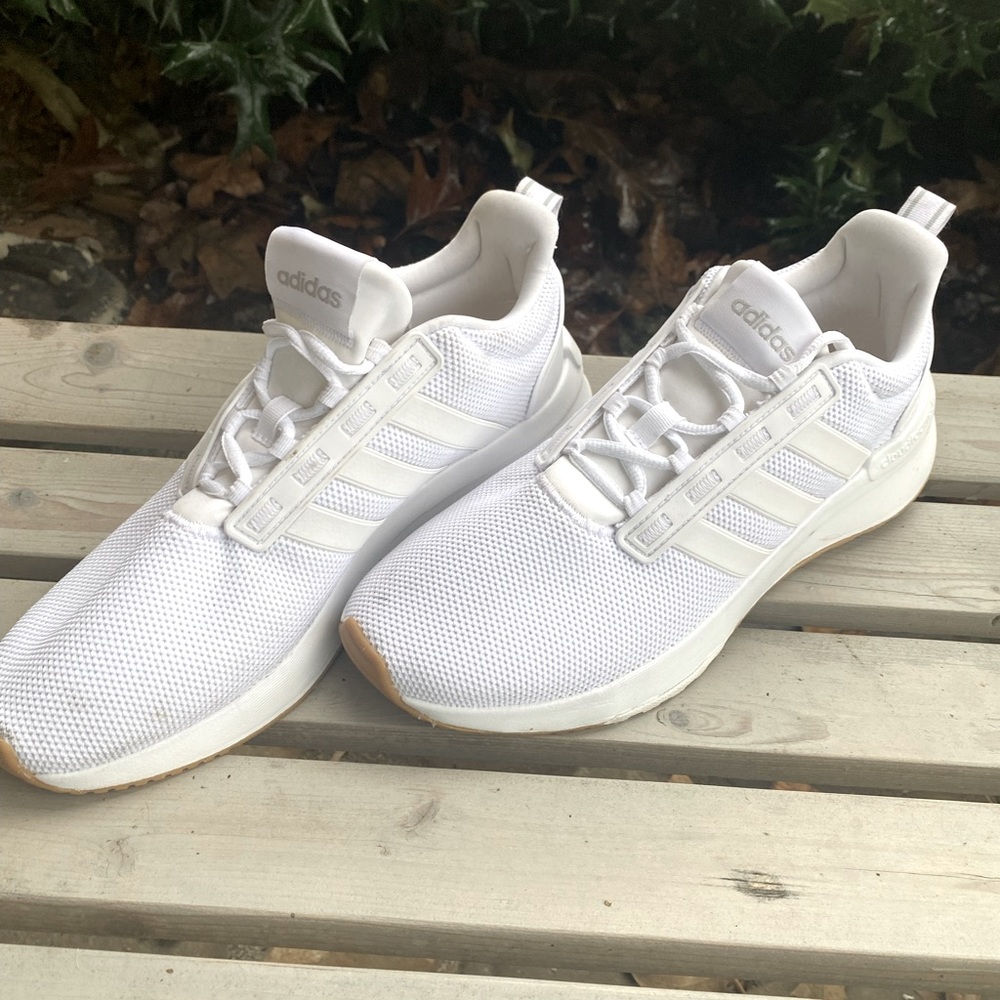 Adidas shoes. White. Never used too big